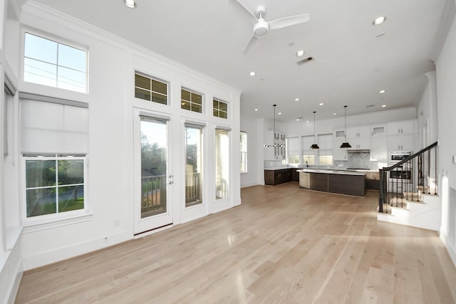 4005 Woodshire Village Ests, Houston, TX 77025 - kitchen with a kitchen island, light countertops, dark brown cabinetry, ceiling fan, and recessed lighting