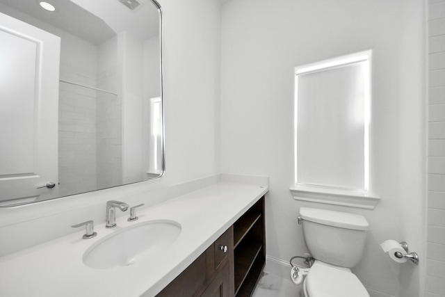 4005 Woodshire Village Ests, Houston, TX 77025 - bathroom featuring vanity, toilet, and a shower
