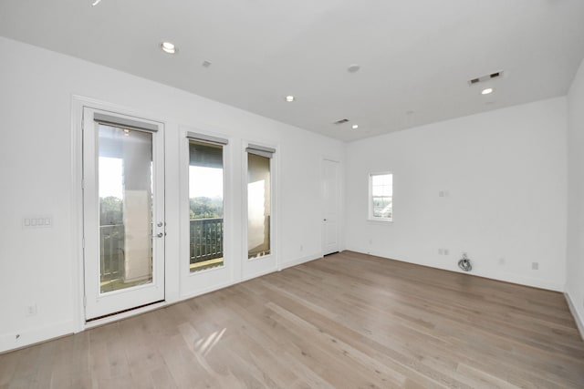 4005 Woodshire Village Ests, Houston, TX 77025 - empty room featuring light wood-style flooring and recessed lighting