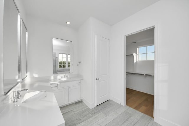 4005 Woodshire Village Ests, Houston, TX 77025 - full bathroom with vanity, healthy amount of natural light, a closet, and wood finished floors