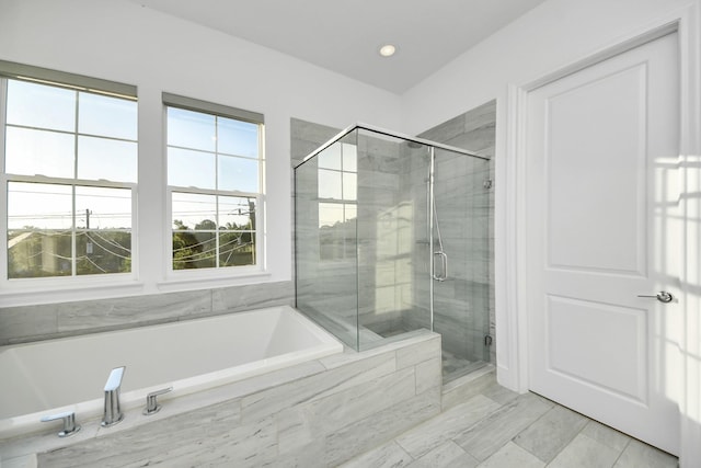 4005 Woodshire Village Ests, Houston, TX 77025 - bathroom featuring a bath, a stall shower, and recessed lighting