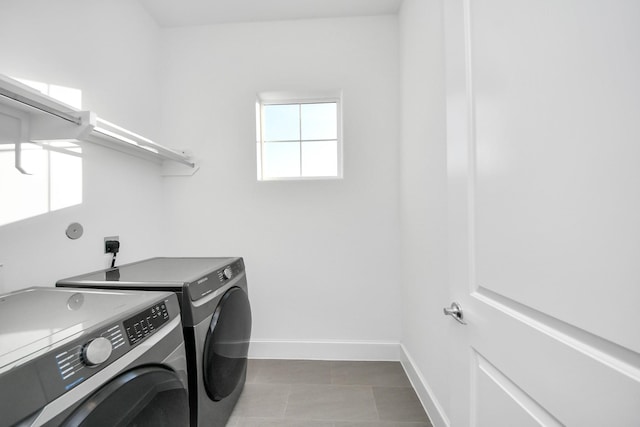 4005 Woodshire Village Ests, Houston, TX 77025 - washroom featuring washing machine and clothes dryer and baseboards
