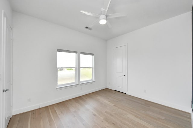 4005 Woodshire Village Ests, Houston, TX 77025 - empty room with light wood-type flooring, ceiling fan, and baseboards