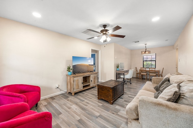 2915 Robertson St, Houston, TX 77009 - living area featuring wood finished floors, baseboards, recessed lighting, and a ceiling fan