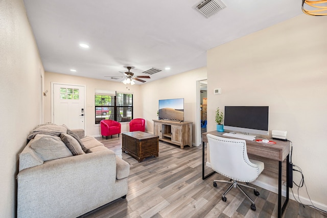 2915 Robertson St, Houston, TX 77009 - home office featuring light wood-style floors, ceiling fan, and recessed lighting
