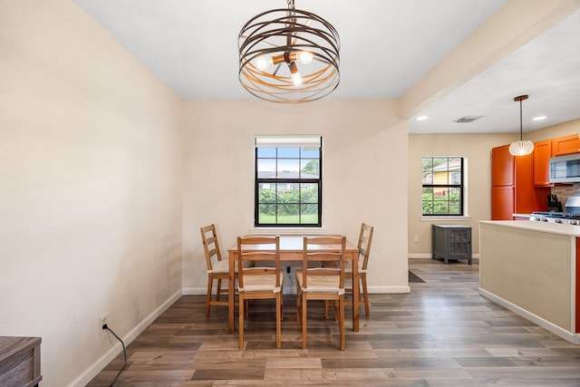 2915 Robertson St, Houston, TX 77009 - dining room featuring recessed lighting, a chandelier, baseboards, and wood finished floors