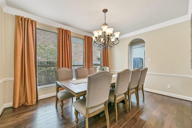 1013 Bolivar Point Ln, Friendswood, TX 77546 - dining room with a chandelier, arched walkways, baseboards, ornamental molding, and dark wood finished floors