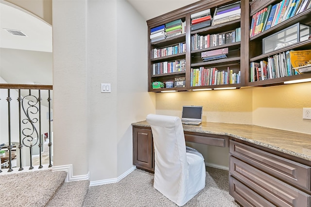 1013 Bolivar Point Ln, Friendswood, TX 77546 - office space with built in study area, light carpet, baseboards, and arched walkways