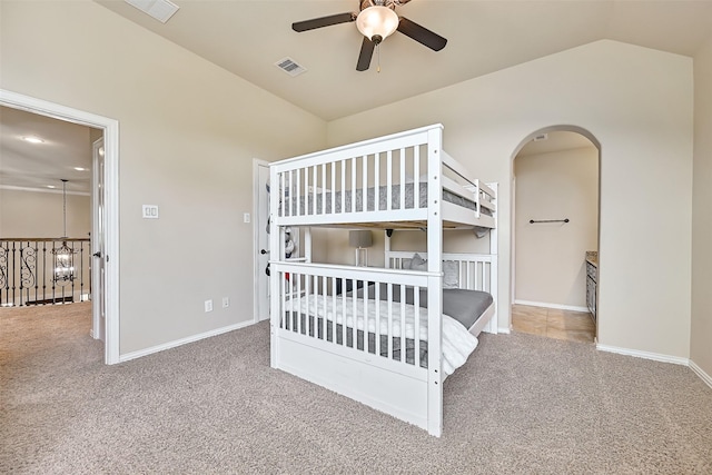 1013 Bolivar Point Ln, Friendswood, TX 77546 - carpeted bedroom featuring lofted ceiling, arched walkways, baseboards, and ceiling fan