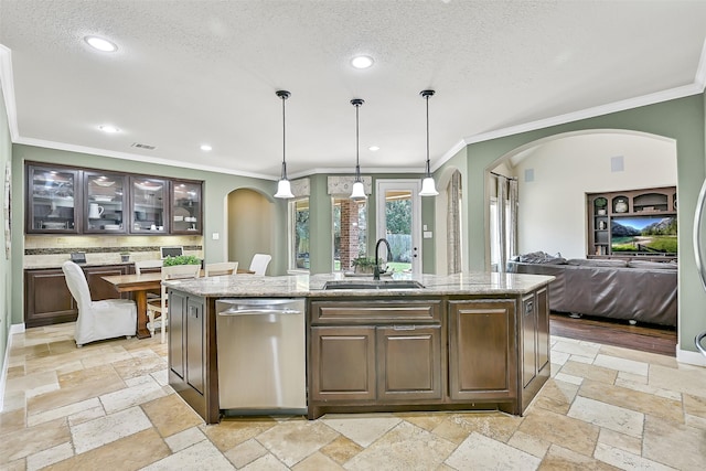 1013 Bolivar Point Ln, Friendswood, TX 77546 - kitchen featuring stainless steel dishwasher, a sink, ornamental molding, arched walkways, and stone tile floors