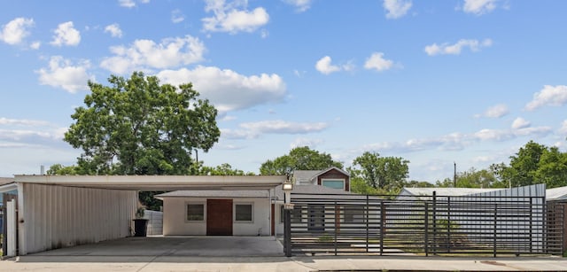 6414 Crestridge St, Houston, TX 77033 - view of front of property featuring a fenced front yard, concrete driveway, a carport, and a gate