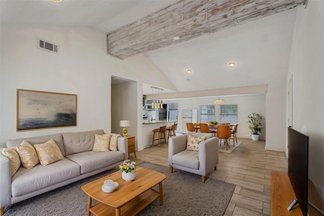 6414 Crestridge St, Houston, TX 77033 - living room with high vaulted ceiling, baseboards, and recessed lighting
