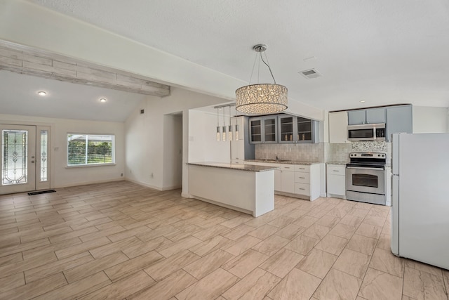 6414 Crestridge St, Houston, TX 77033 - kitchen with appliances with stainless steel finishes, decorative backsplash, glass insert cabinets, hanging light fixtures, and light stone countertops