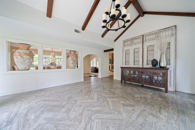 14119 Kiamesha Ct, Houston, TX 77069 - unfurnished living room with a chandelier, arched walkways, baseboards, beamed ceiling, and high vaulted ceiling