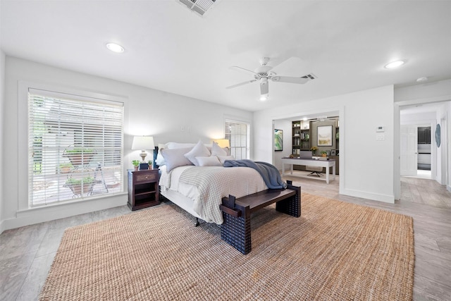 14119 Kiamesha Ct, Houston, TX 77069 - bedroom with baseboards, ceiling fan, recessed lighting, and light wood-style floors