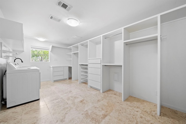 14119 Kiamesha Ct, Houston, TX 77069 - walk in closet with independent washer and dryer