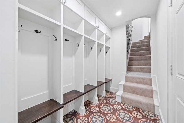 14119 Kiamesha Ct, Houston, TX 77069 - mudroom with arched walkways, baseboards, and recessed lighting