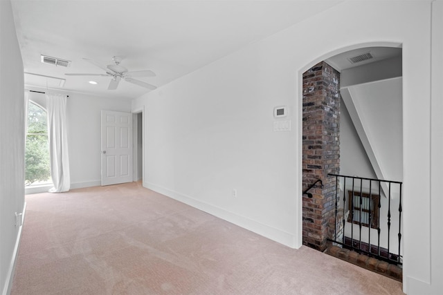 14119 Kiamesha Ct, Houston, TX 77069 - carpeted spare room featuring ceiling fan, arched walkways, and baseboards
