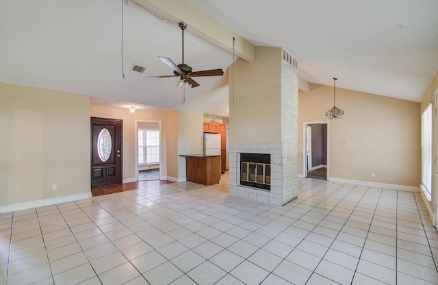 10402 Eagle Glen Dr, Houston, TX 77041 - unfurnished living room featuring light tile patterned floors, a ceiling fan, a brick fireplace, beamed ceiling, and high vaulted ceiling