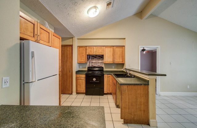 10402 Eagle Glen Dr, Houston, TX 77041 - kitchen featuring freestanding refrigerator, black range with electric cooktop, a peninsula, dark countertops, and light tile patterned flooring