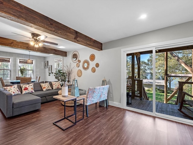 14510 Henry Calfee Dr, Willis, TX 77318 - living room featuring dark wood-style floors, a ceiling fan, plenty of natural light, baseboards, and beam ceiling