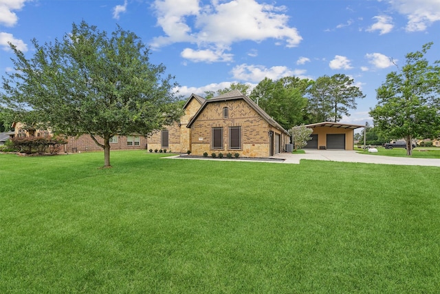 28411 Calaveras Creek Ct, Houston, TX 77336 - english style home with driveway, a front lawn, and a detached garage