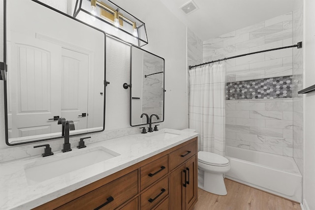 28411 Calaveras Creek Ct, Houston, TX 77336 - full bathroom with double vanity, shower / bath combo with shower curtain, toilet, and wood finished floors