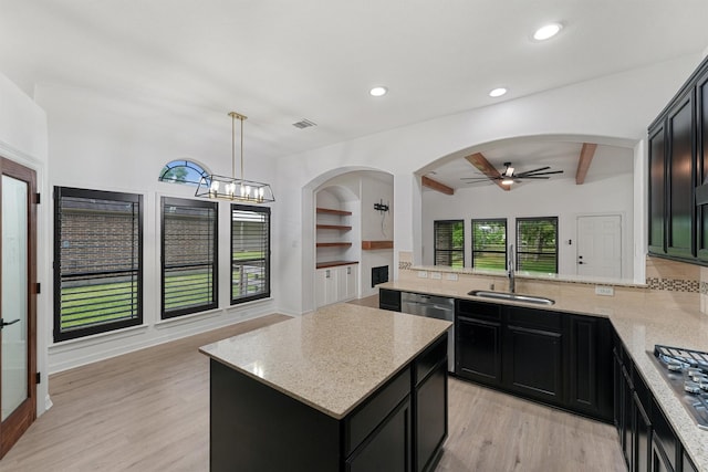 28411 Calaveras Creek Ct, Houston, TX 77336 - kitchen featuring stainless steel appliances, ceiling fan, dark cabinets, a sink, and light stone countertops