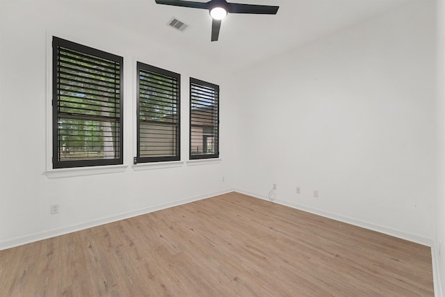 28411 Calaveras Creek Ct, Houston, TX 77336 - spare room with light wood-type flooring, ceiling fan, and baseboards