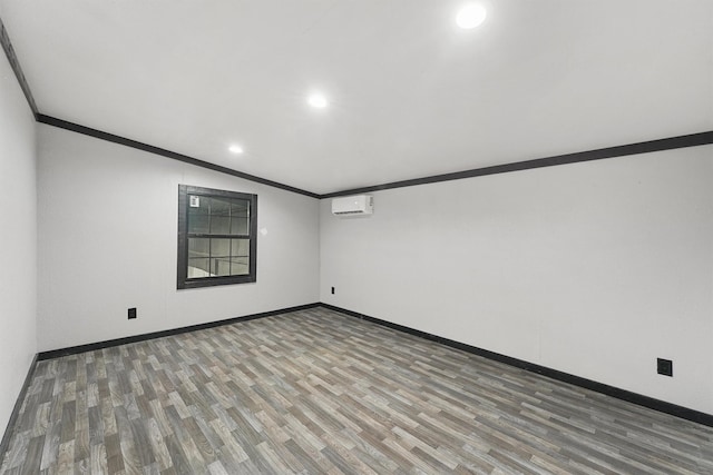 28411 Calaveras Creek Ct, Houston, TX 77336 - spare room featuring a wall mounted AC, ornamental molding, wood finished floors, baseboards, and recessed lighting