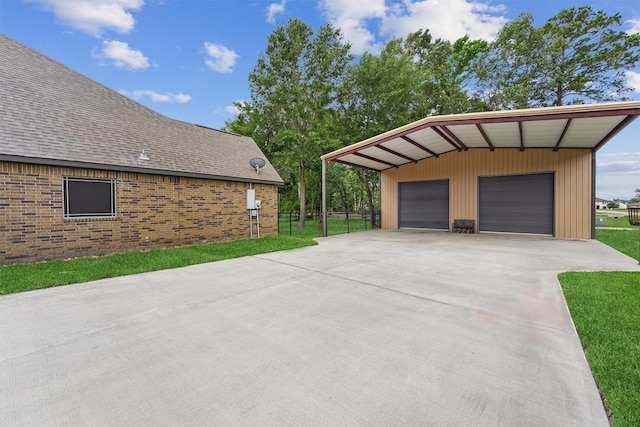 28411 Calaveras Creek Ct, Houston, TX 77336 - view of home's exterior featuring a garage, an outdoor structure, and roof with shingles