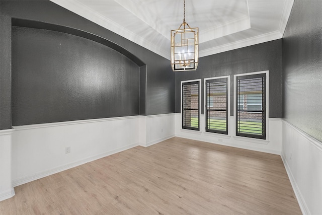 28411 Calaveras Creek Ct, Houston, TX 77336 - spare room with wood finished floors, a chandelier, ornamental molding, wainscoting, and a textured wall