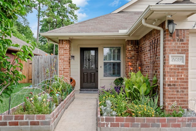 2639 Cypress Island Dr, Houston, TX 77073 - view of exterior entry with brick siding and an attached garage
