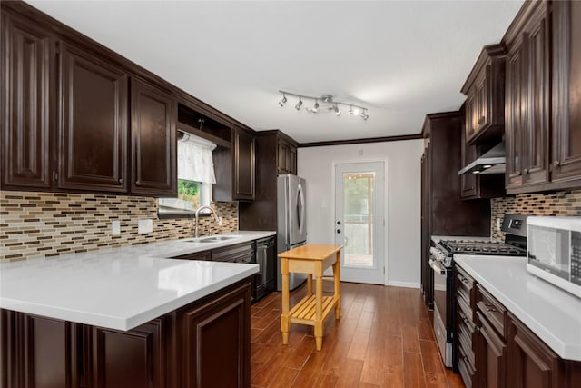 2639 Cypress Island Dr, Houston, TX 77073 - kitchen with stainless steel appliances, dark brown cabinetry, a sink, and light countertops