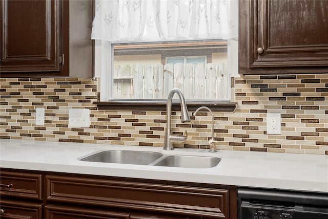 2639 Cypress Island Dr, Houston, TX 77073 - kitchen with dishwashing machine, a sink, dark brown cabinetry, and light countertops