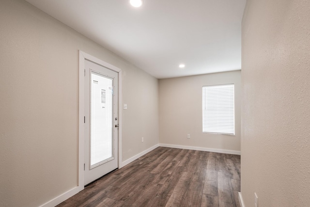 308 Greenbriar Dr, Baytown, TX 77520 - empty room featuring dark wood-type flooring, recessed lighting, and baseboards
