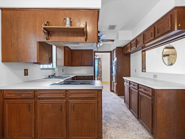 21326 Four Oaks Dr, Houston, TX 77073 - kitchen with black electric stovetop, ceiling fan, stainless steel oven, light countertops, and a sink
