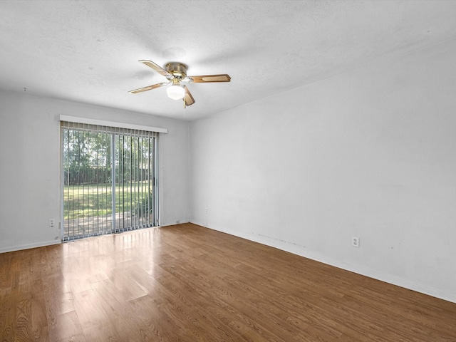 21326 Four Oaks Dr, Houston, TX 77073 - empty room with ceiling fan, wood finished floors, baseboards, and a textured ceiling