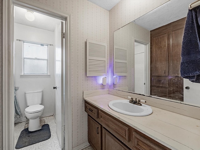 21326 Four Oaks Dr, Houston, TX 77073 - bathroom featuring vanity, toilet, and wallpapered walls