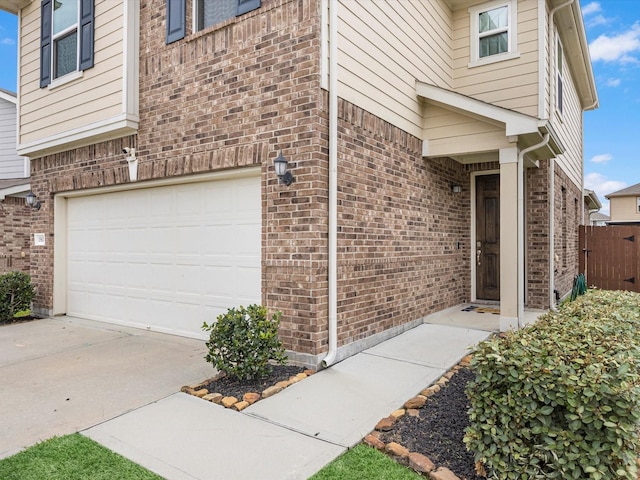 15618 Cliffside Arbor Ln, Houston, TX 77044 - entrance to property with an attached garage, brick siding, and concrete driveway