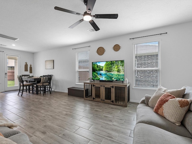 15618 Cliffside Arbor Ln, Houston, TX 77044 - living area featuring ceiling fan, wood finish floors, baseboards, and recessed lighting