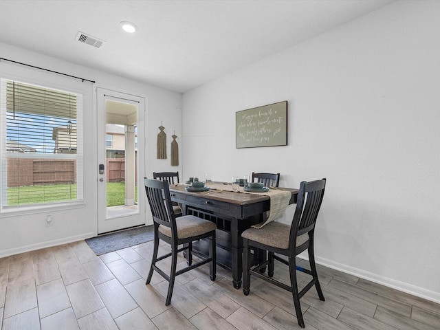 15618 Cliffside Arbor Ln, Houston, TX 77044 - dining space with wood tiled floors, baseboards, and recessed lighting