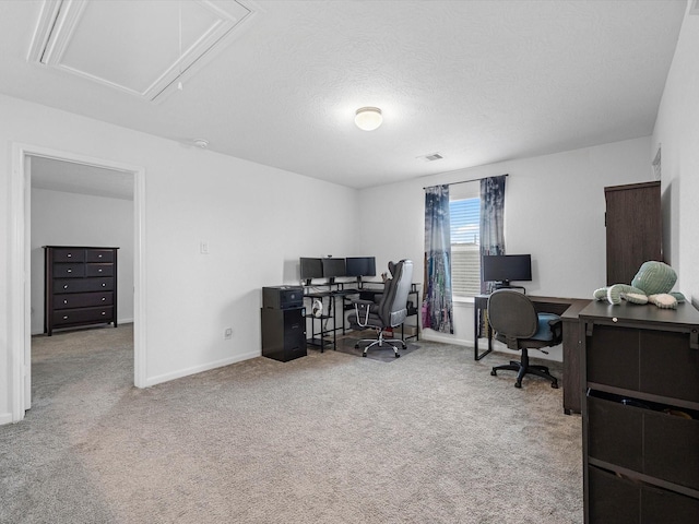 15618 Cliffside Arbor Ln, Houston, TX 77044 - carpeted home office with attic access, baseboards, and a textured ceiling