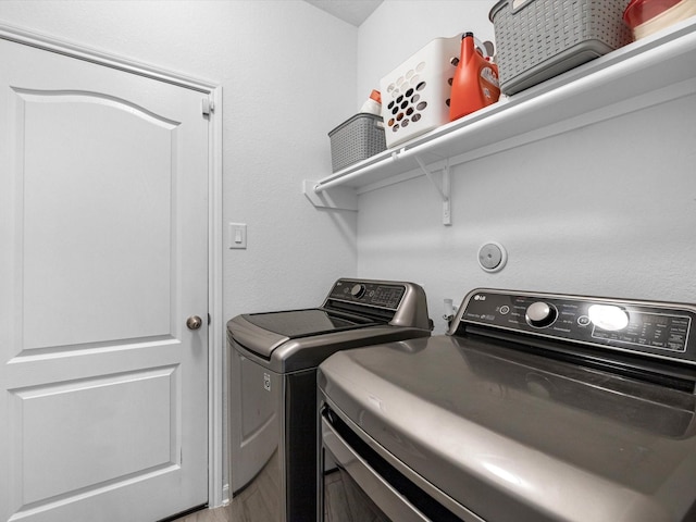 15618 Cliffside Arbor Ln, Houston, TX 77044 - laundry area with separate washer and dryer