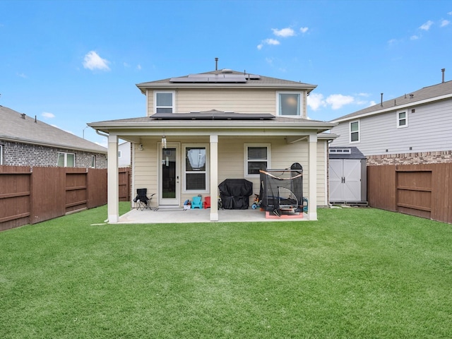 15618 Cliffside Arbor Ln, Houston, TX 77044 - rear view of property featuring a patio and roof mounted solar panels
