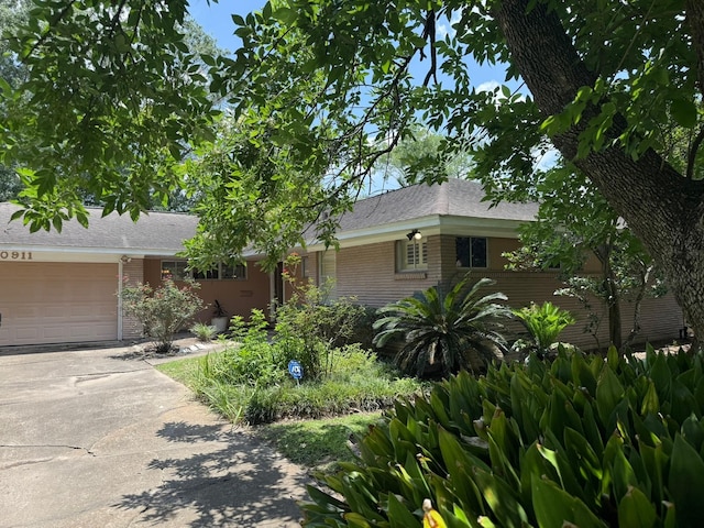 10911 Cedarhurst Dr, Houston, TX 77096 - ranch-style home with a garage, concrete driveway, and brick siding
