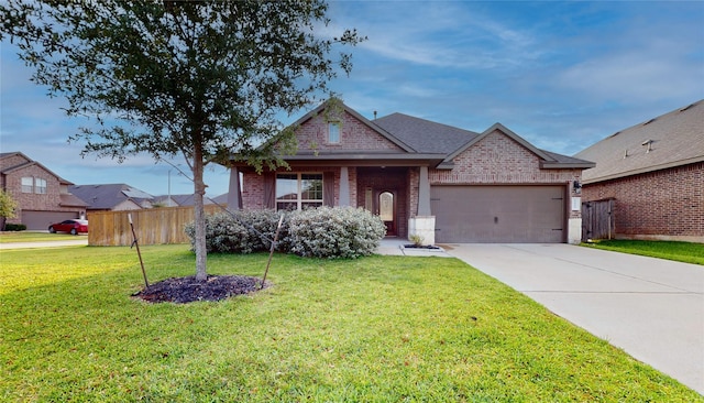 5434 Wildbrush Dr, Richmond, TX 77407 - view of front facade with brick siding, a garage, and concrete driveway