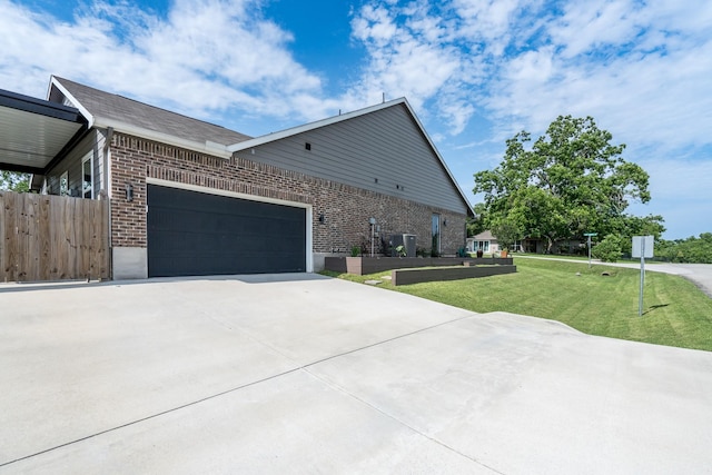 454 Cape Conroe Dr, Montgomery, TX 77356 - view of side of property with brick siding, concrete driveway, and an attached garage
