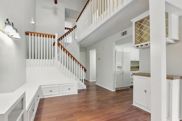 3126 Windchase Blvd Unit 421, Houston, TX 77082 - stairs with wood finished floors and a towering ceiling