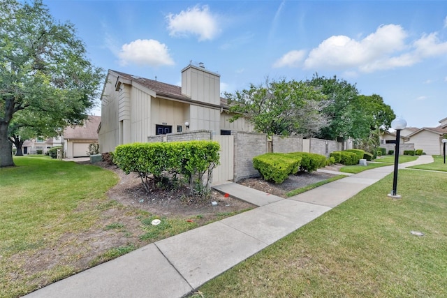 3126 Windchase Blvd Unit 421, Houston, TX 77082 - view of property exterior with a chimney